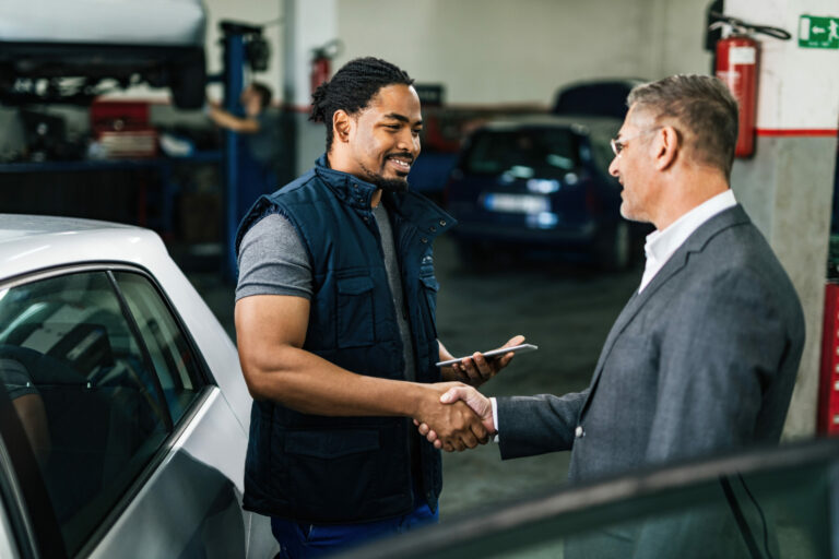 automotive dealer explaining customer