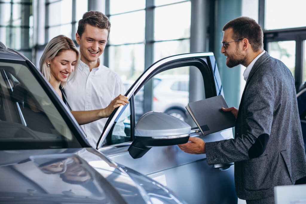 Car Dealer Explaining Customer