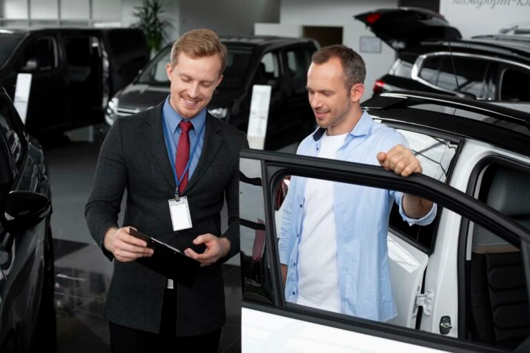 automotive dealer explaining customer