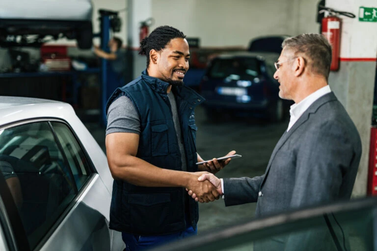 automotive dealer explaining customer